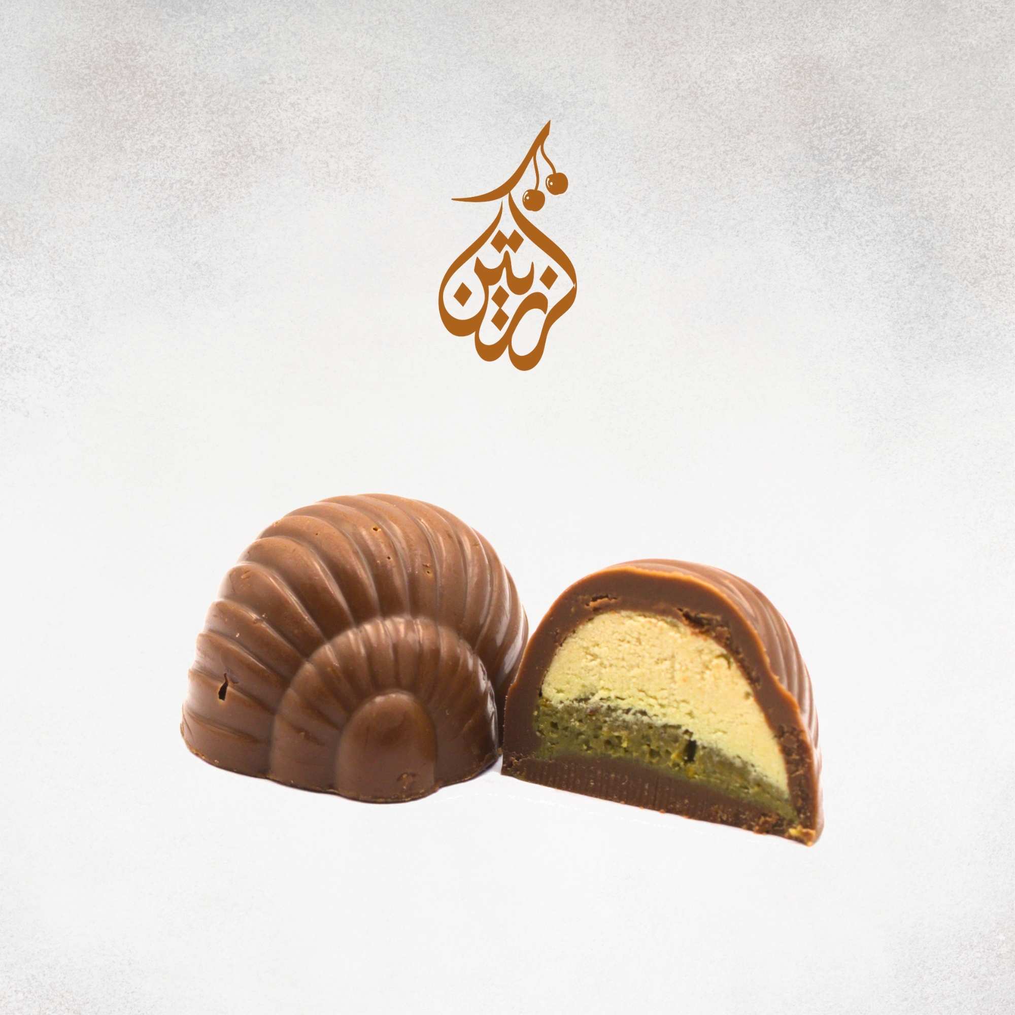 A piece of luxury Belgian chocolate with AHSH HALAWA and pistachio cream