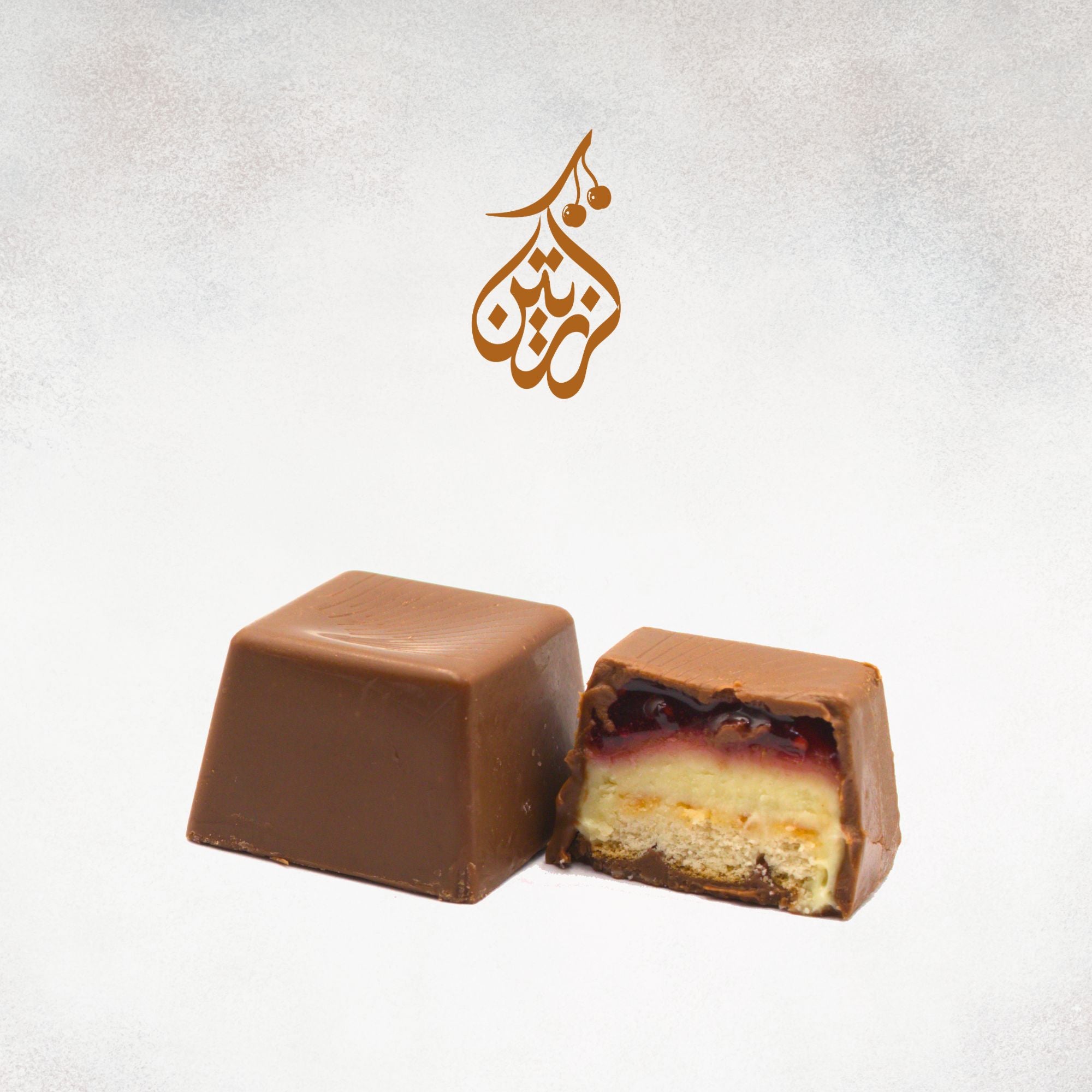 A piece of fine Belgian chocolate with strawberry cheesecake.
